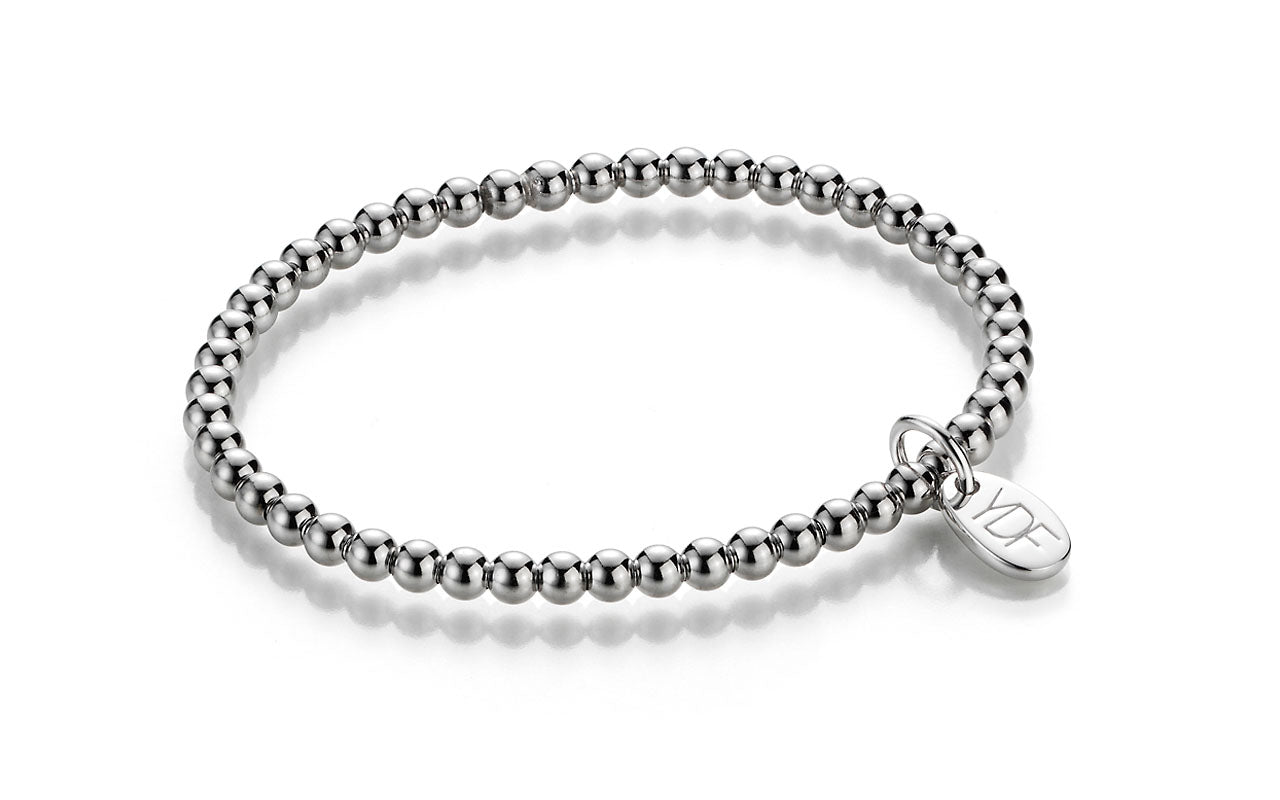 Stretch Silberarmband mit Loganhänger und Diamant