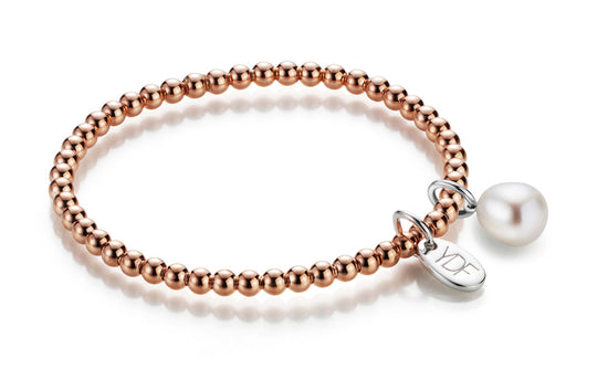Stretch Silberarmband rosevergoldet mit Loganhänger und Diamant und Perle